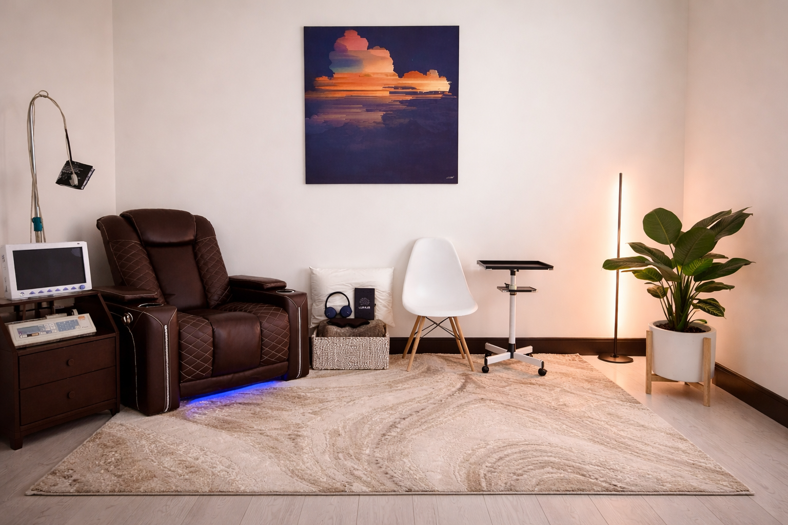 LUMUS private infusion suite featuring a luxury recliner, calming cloud artwork, ambient lighting, headphones, and natural elements